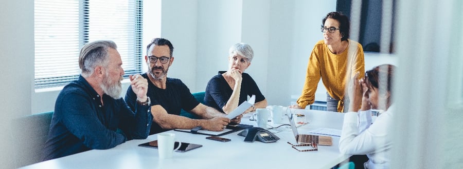 Photo of a group of auditors having an implementation meeting