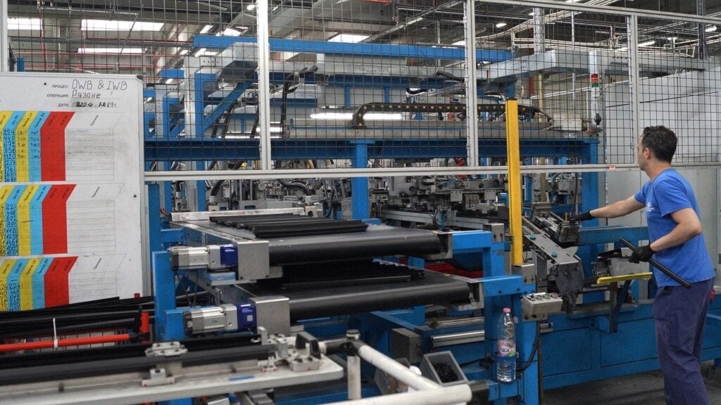 image of a worker in an auto parts factory symbolizing IATF regulations
