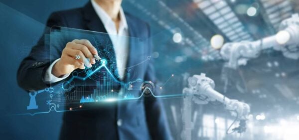 Manager engineer analyzing and control automation robot arms machine on software modern virtual interface data real time in intelligent factory industrial and digital manufacturing operation.